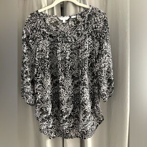 Sheer, 3/4 sleeve floral pattern blouse.